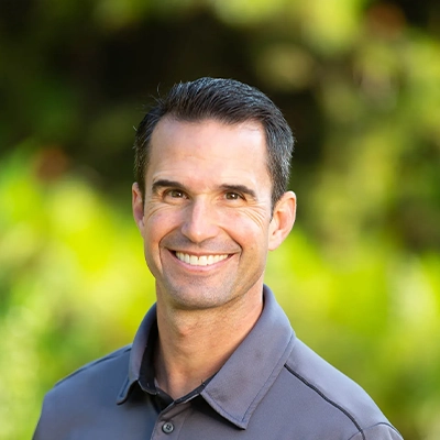 Office Manager Chris Jordan Smiling Outdoors
