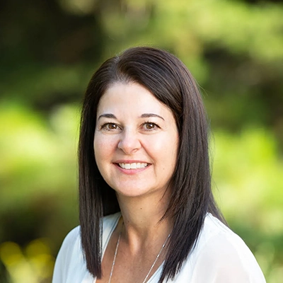 Dentist Sherry Jordan Smiling Outdoors