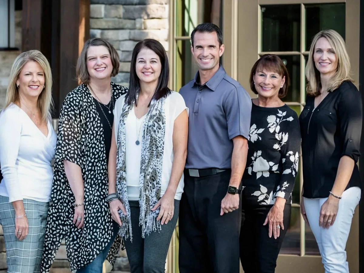 Dentist Sherry Jordan With Her Team Outside The Office